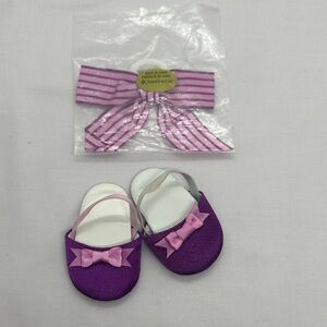 American Girl Rebecca Rubin’s Purple Doll slippers with matching bow. Retired.
